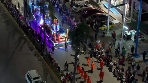 Aerial View of Illuminated Parade Float with Giant Skull and Dancers at Night. Video stock 337907285