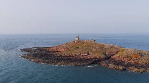 Aerial view of Ilot Saint Michel, a small rocky island off the coast of Erquy in Stock Footage 346667281