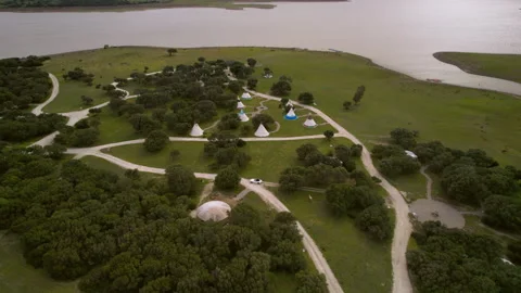 Aerial view on Indian teppee on the shore of the lake Stock Footage 260046289