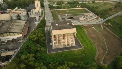 Aerial View of Industrial Complex Surrounded by Lush Greenery in Malaysia During Stock Footage 316447598