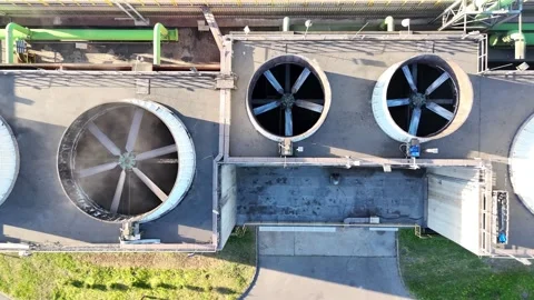 Aerial view of industrial cooling system with large fans and green ventilation Видео 334303482