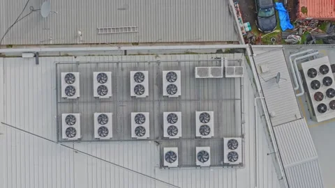 Aerial View of Industrial Data Center Rooftop Cooling Units and HVAC Systems Stock Footage 341502013