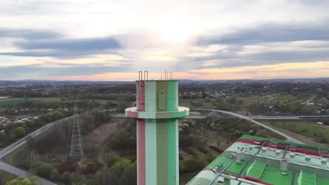 Aerial view of industrial emissions stack releasing vapor into the atmosphere Stock Footage 332280381