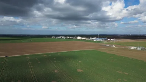 Aerial View of Industrial Facility Surrounded by Farmland – Germany 4K Stock Footage 341850677