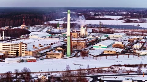 Aerial view of industrial factory complex with smokestack emitting smoke in Video stock 346596485
