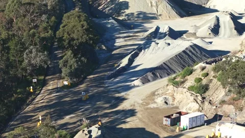 Aerial view of industrial mining quarry with large sand piles Stock Footage 340131063