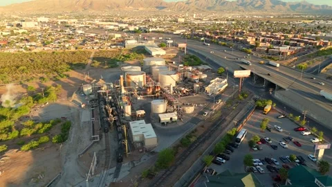 Aerial View of Industrial Processing Plant Beside Major Highway Stock Footage 334950815
