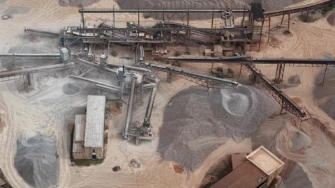 Aerial view of an industrial quarry processing aggregate and stone using Stock Footage 342700179