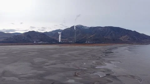 Aerial view of industrial smelter stack near Great Salt Lake in Magna, Utah Stock Footage 333919624