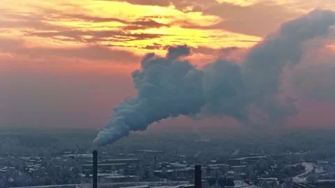Aerial view of industrial smoke stack at sunset in Europe. 動画素材 341482252