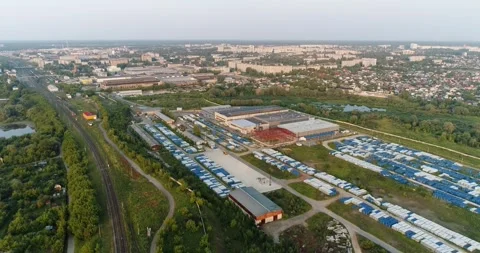 Aerial view of an industrial warehouse with infrastructure for storage Stockbeeldmateriaal 294893853