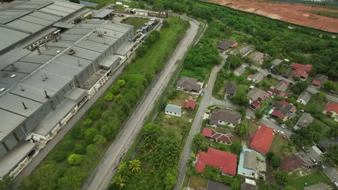 Aerial View of Industrial Zone Adjacent to Residential Neighborhood Stockbeeldmateriaal 337330059