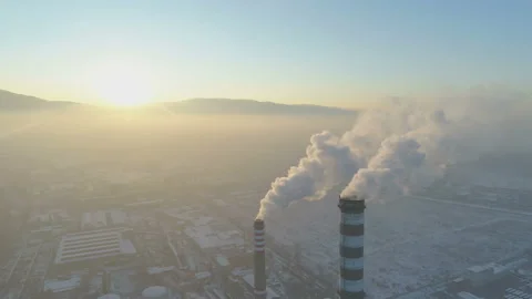 Aerial view of Industrial zone with a large red and white smoking chimney pipes Stock Footage 144317239