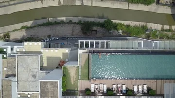 Aerial view of infinite pool from a drone in Kuala Lumpur Malaysia tilting up Stock Footage 85533396