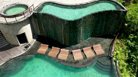 Aerial view to infinity hotel pool in luxury hotel resort. Luxury round pool Stock Footage 158754586