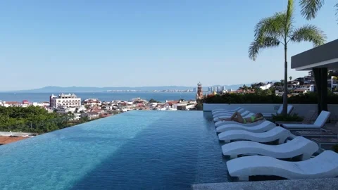 Aerial view infinity rooftop pool person city, Puerto Vallarta Mexico Stock Footage 160941618