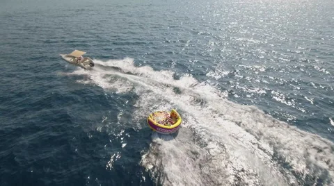 Aerial view of inflatable towable ski tubes, sofa ride Vidéo 67224858