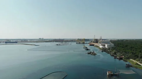 Aerial view of a infrastructure of a seaport, with various industries. Stock Footage 137223277