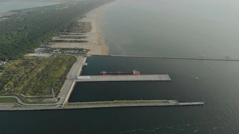 Aerial view of a infrastructure of a seaport, with various industries. Stock Footage 137225882
