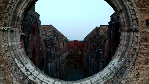 Aerial view of the inside Abbey of San Galgano from the central rose window Stock Footage 135408995