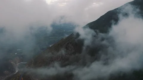 Aerial view inside clouds in Canyon del Colca in the Andes Mountains in Peru 4K Stock Footage 197266166