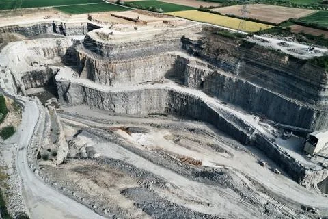 Aerial view of the inside of a deep stone quarry in Germany, Steinbruch Stock Photos