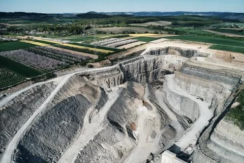 Aerial view of the inside of a deep stone quarry in Germany, Steinbruch Stock Photos