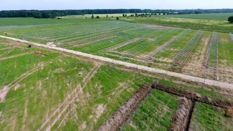 Aerial view of installing solar field pillars construction project. in country. Stock Footage 105174019