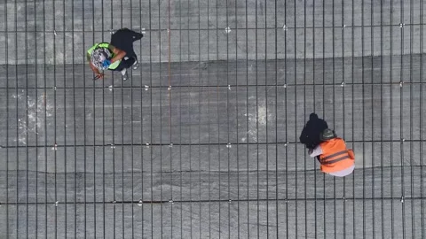 Aerial View: Insulation experts and foundation builders team up at this busy Stock Footage 296083230