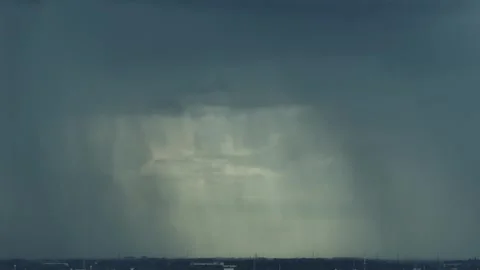 Aerial view of intense rain beneath dark storm clouds. Stock Footage 345428244