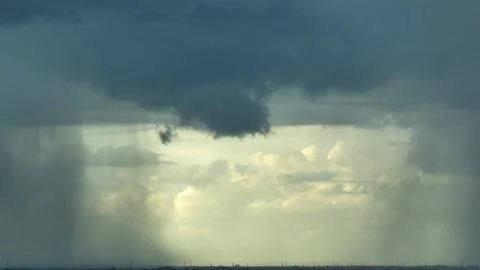 Aerial view of intense rain beneath dark storm clouds. Stock Footage 345428255