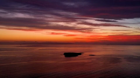 Aerial view of an intense sunset over the sea Video stock 124416713