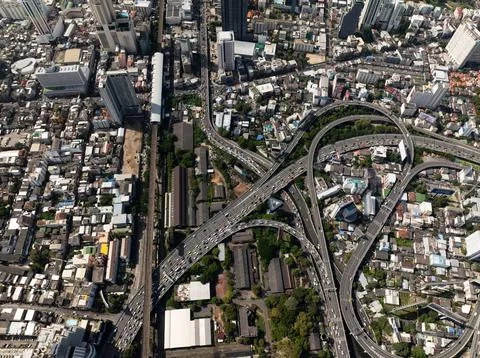 Aerial view of interconnected highways and surrounding urban areas. Bangkok Stock Photos