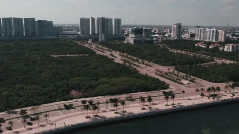 Aerial view to intersection in green landscape. Empty roads in Cancun, Mexico Stock Footage 233429629
