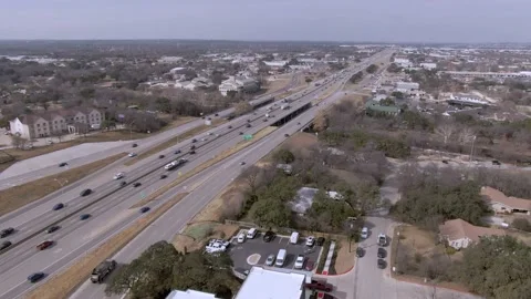 Aerial view of Interstate 35 near downtown Round Rock, Texas on a sunny Stock Footage 194544125