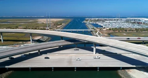 Aerial view of an interstate freeway intersection junction on a sunny day Stock Footage 111605969