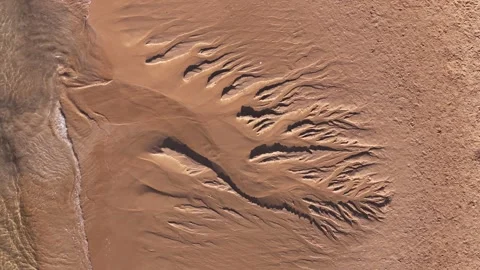 Aerial view of intricate sand patterns on the beach, Portugal. Stock Footage 340002493
