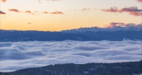 Aerial view of inversion clouds moving in Alpine valley Stock Footage 166879721