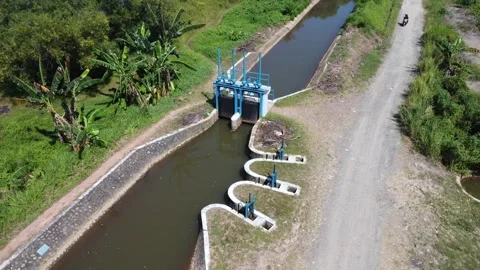 Aerial view of irrigation river flow, water inlet to flow water in agricult.. Stock Footage 315664407