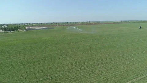 Aerial view on a irrigation system on the wheat field Stock Footage 78436567