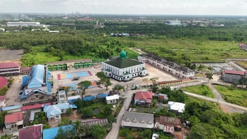 Aerial view of an Islamic boarding school with a large mosque inside Stock Footage 340642185