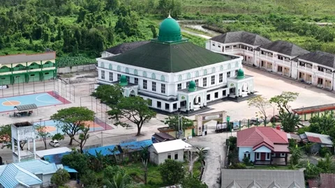 Aerial view of an Islamic boarding school with a large mosque inside Stock Footage 340642296