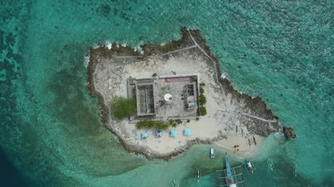 Aerial View of an islet with a lighthouse Stock Footage 246624982