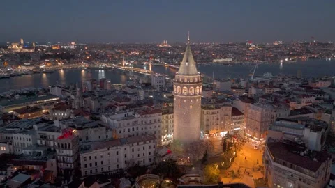 Aerial view of Istanbul at night, featuring the illuminated Galata Tower Видео 346490045