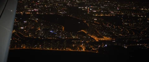 Aerial view of Istanbul from plane window at night. Plane flying above Turkey Stock Footage 127137076