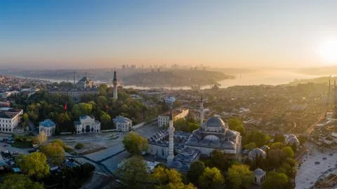An Aerial view of Istanbul with rising sun shining through morning mist. Stock Photos
