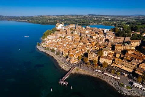 Aerial view of an Italian town over the lake, by drone. Anguillara Sabazia Stock Photos