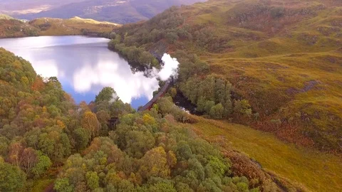 Aerial view of Jacobite steam train near Glenfinnan in Scotland Stock Footage 127409501