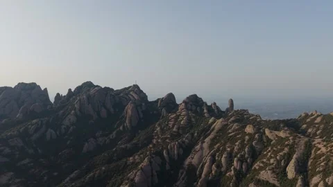 Aerial view of a jagged mountain ridge at sunset Video stock 343324784