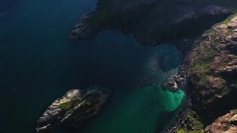 Aerial view of the Jagged Mountains, Lochs and Sea on the Isle of Skye, Scotland Stock Footage 251636282